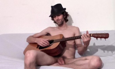 Apollo plays guitar naked